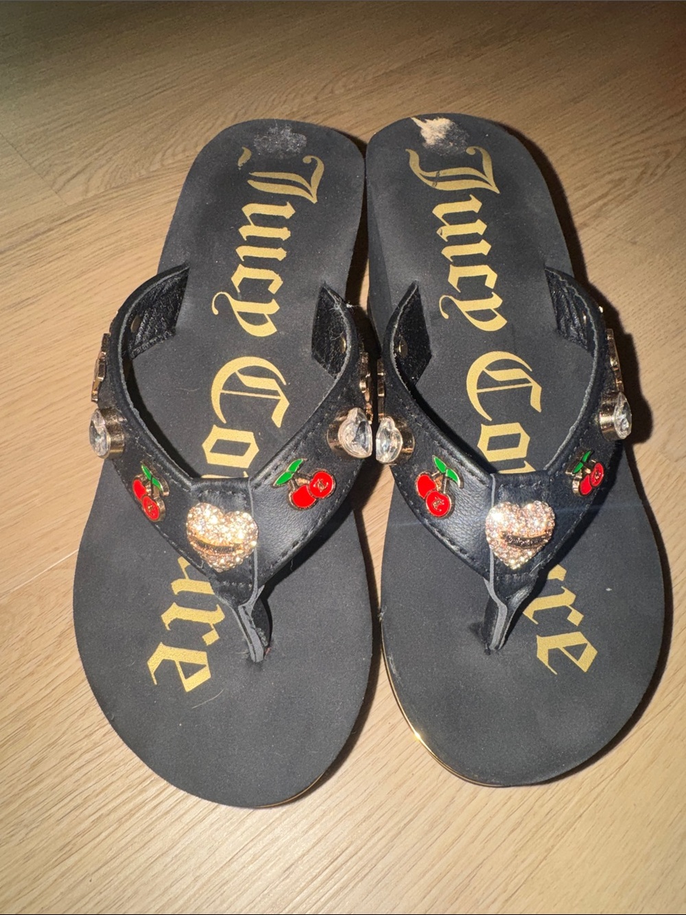 Juicy Couture Black Flip Flops with Gold Logo and Red Cherry Accents
